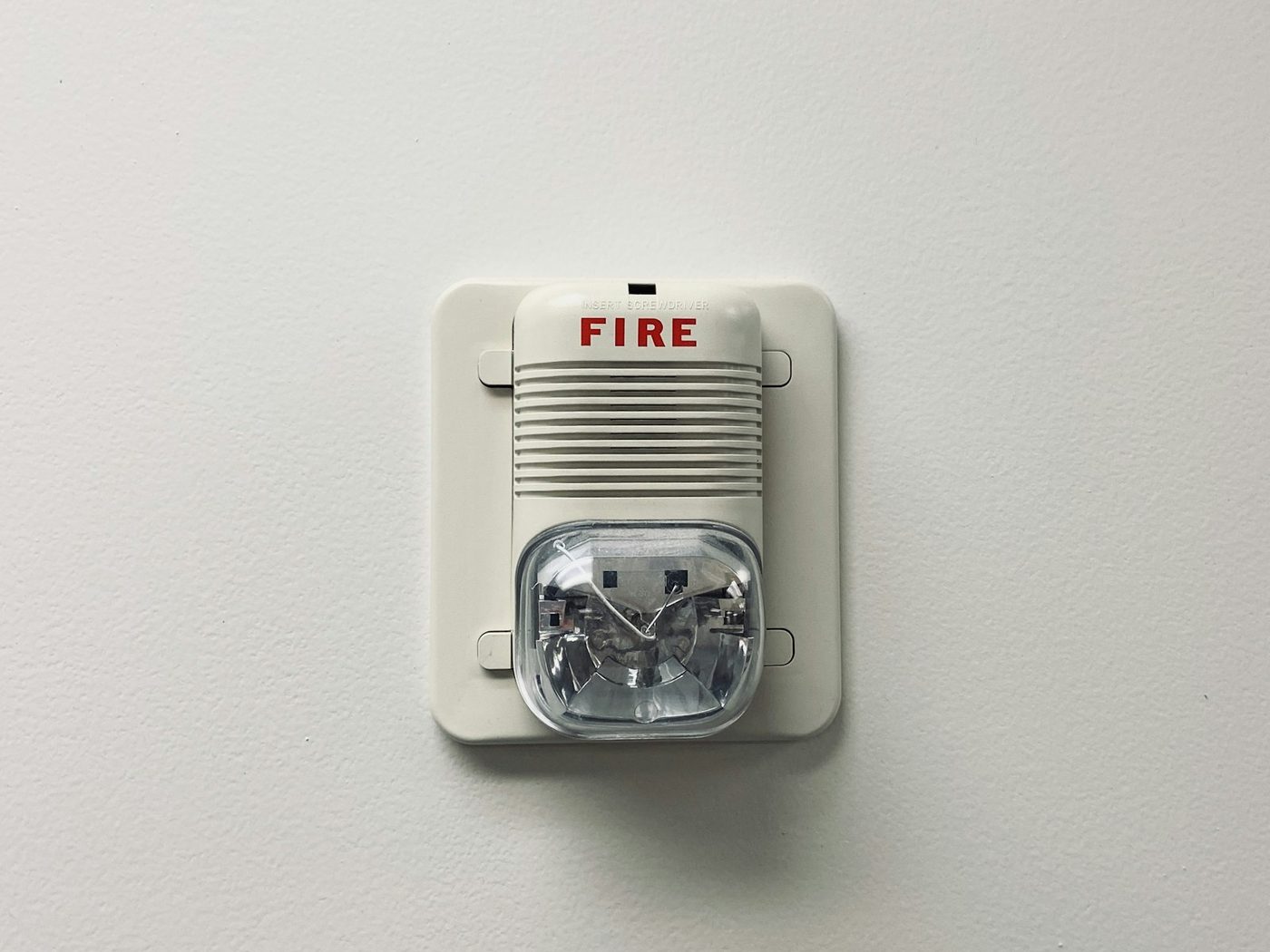 A sounder with a visual beacon, typical of a Grade A or commercial system.