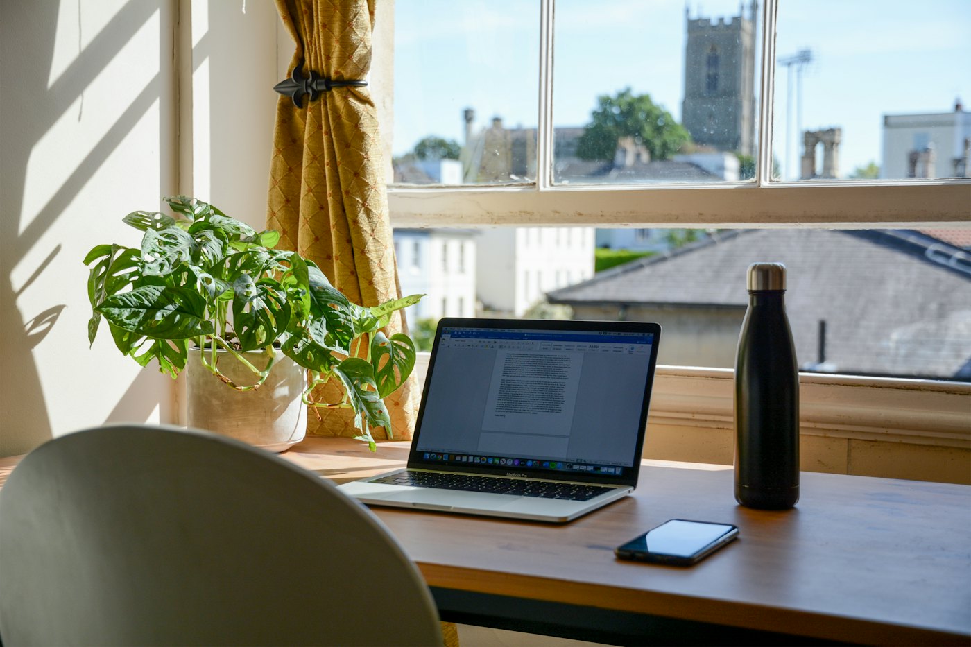 A home office desk by a window