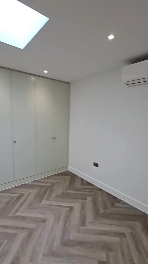 After: the bedroom area with fitted wardrobes, downlights and sockets