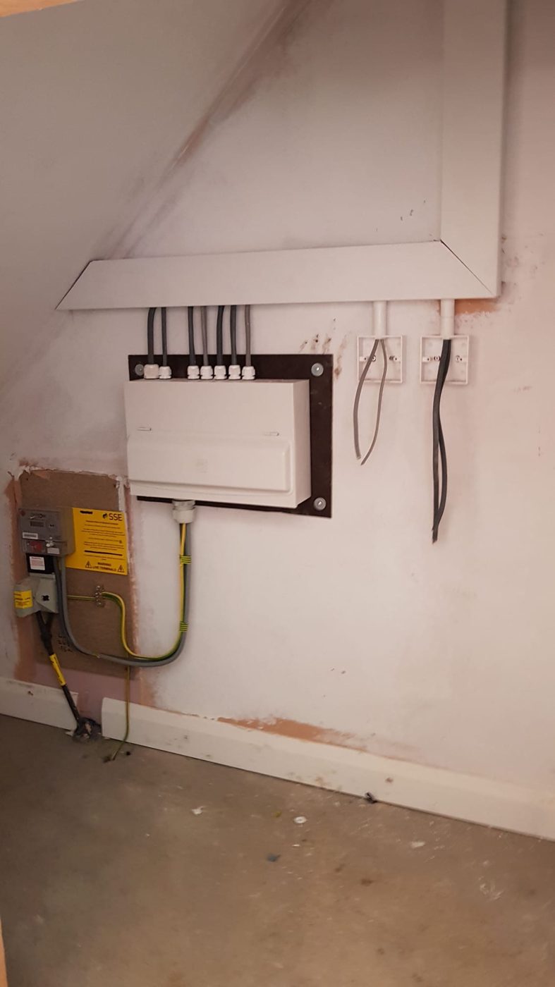 A new board fitted under the stairs, with tidy trunking and the main earth in place
