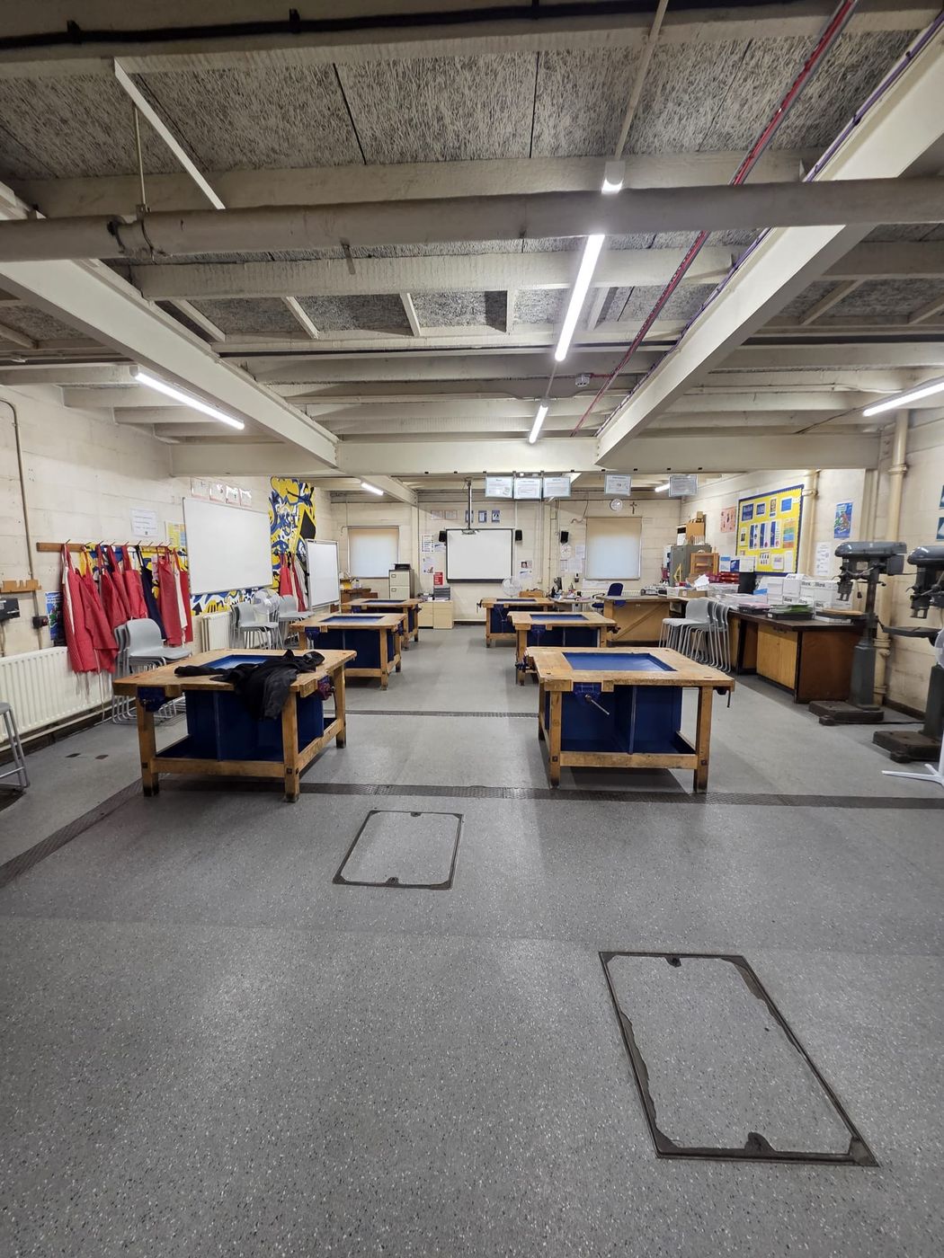The main design and technology workshop at St Columba's, lit by new LED battens between the steel beams