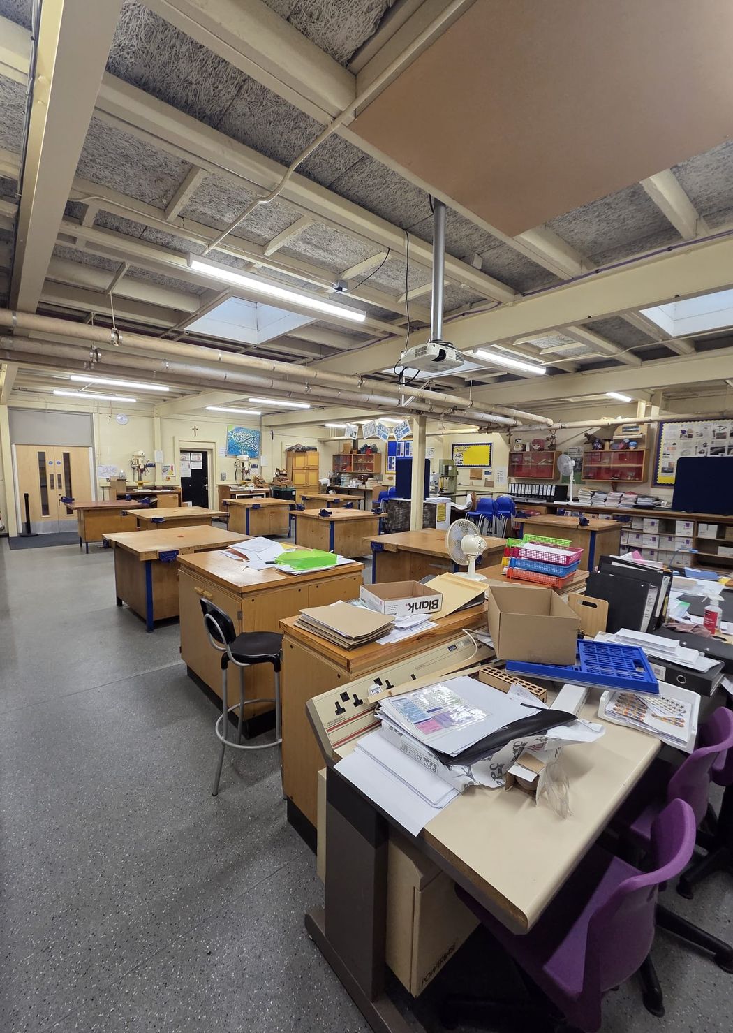 The second workshop, with LED battens run along the beams over the benches and machines