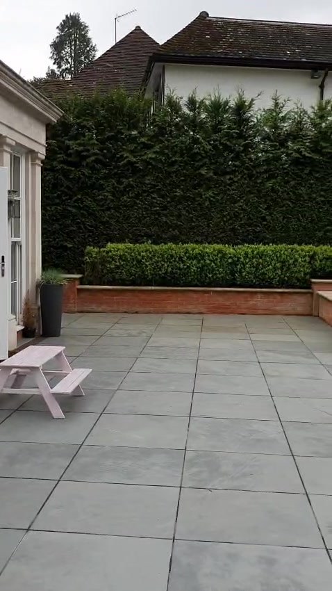 The main terrace beside the orangery, with lighting in the surrounding walls