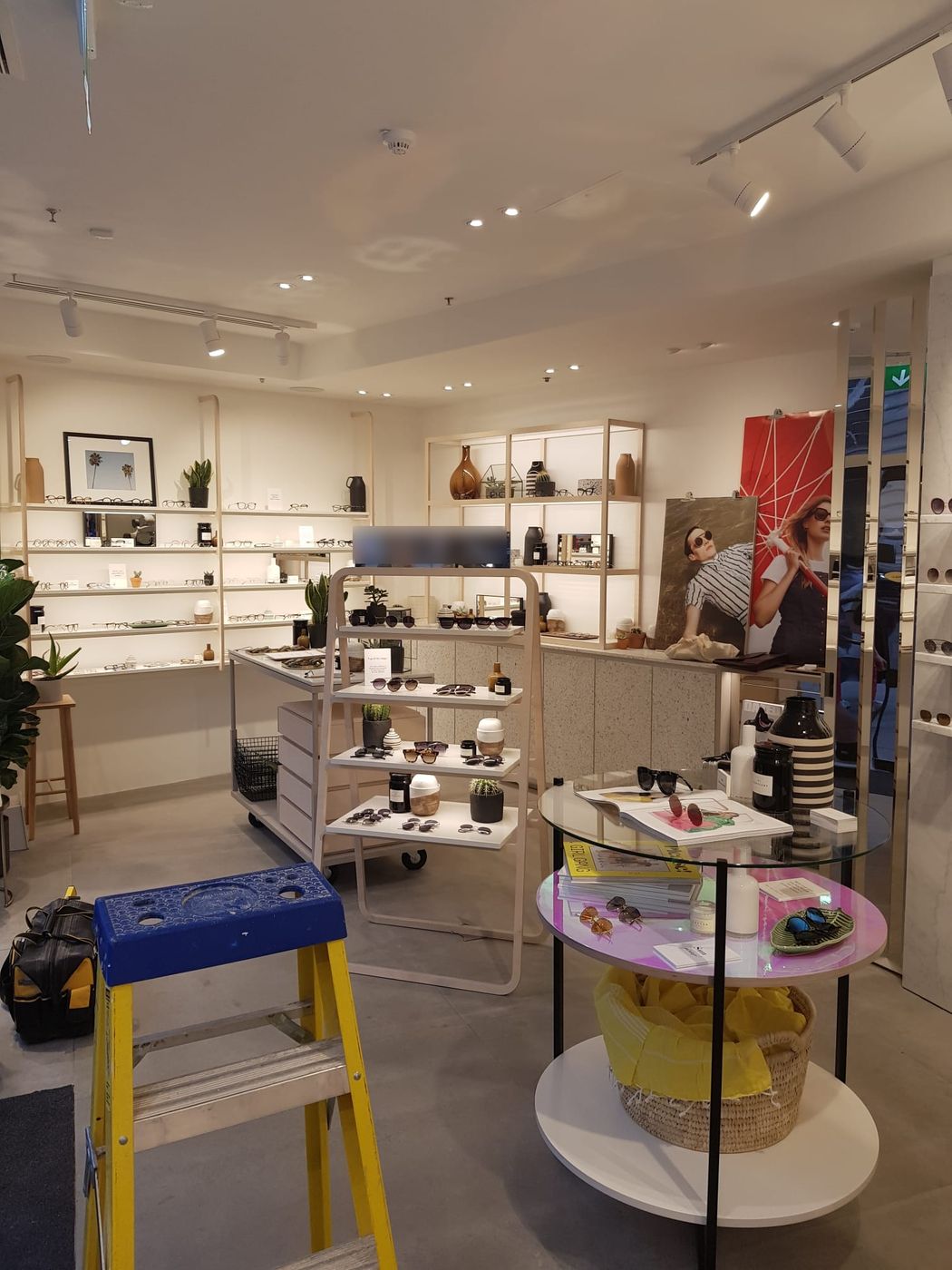 The shop floor: downlights, track lighting and lit shelving bringing every display to life