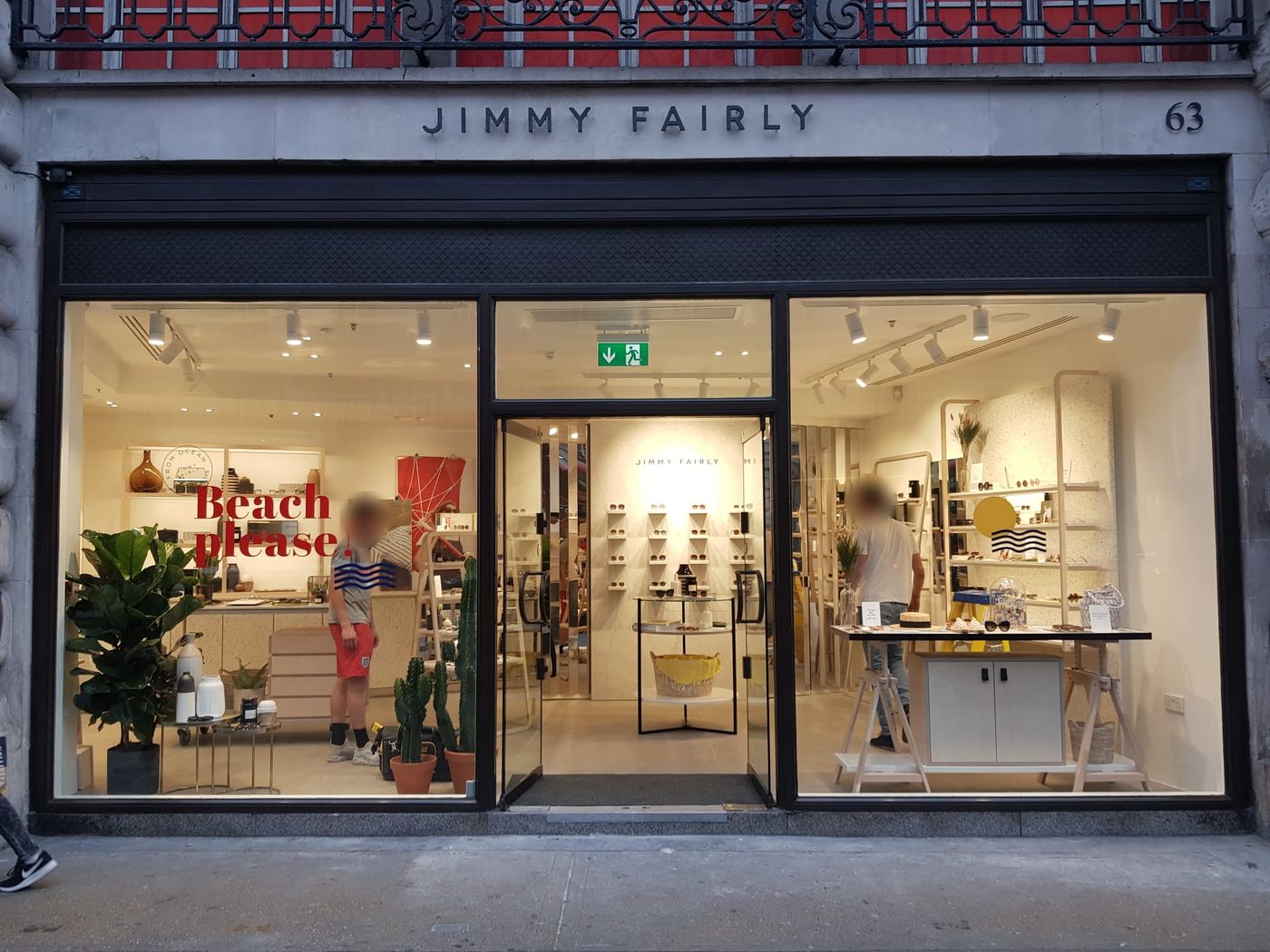 The finished Jimmy Fairly shopfront at 63 Regent Street, lit up for opening