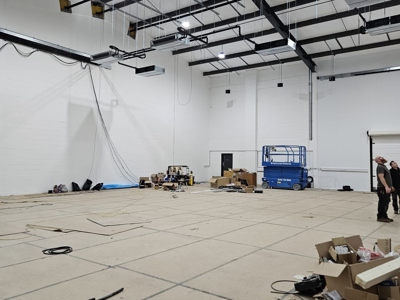 An empty warehouse at the start of a full electrical fit-out