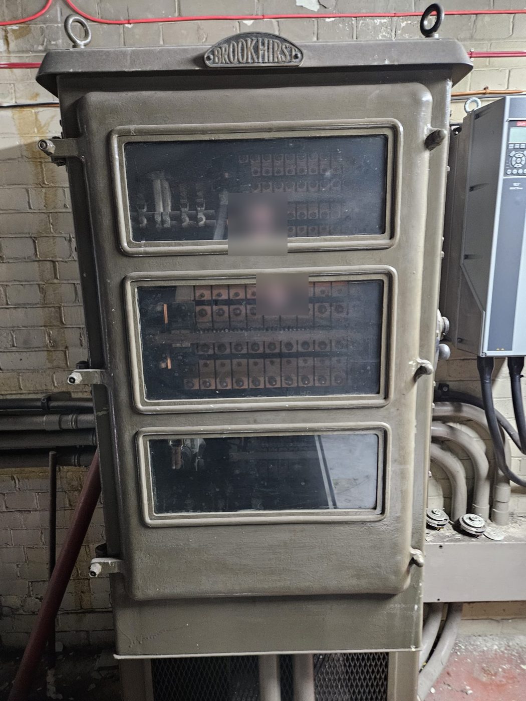 Original Brookhirst switchgear, still in place alongside a modern variable speed drive